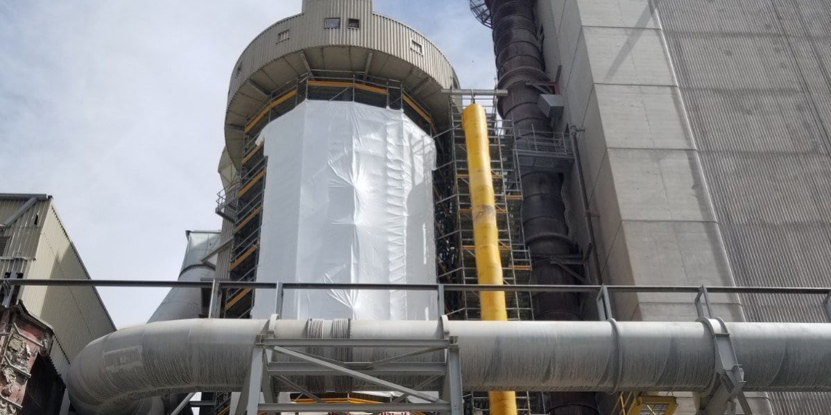 industrial access scaffold with shrink wrap and garbage chute