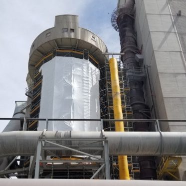 industrial access scaffold with shrink wrap and garbage chute